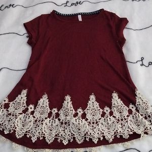 Maroon shirt, white lace on bottom, small